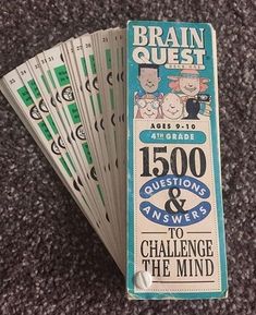 five brain quest cards sitting on top of a carpeted floor with the words, 500 questions and answers to challenge the mind