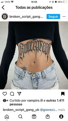 the back of a woman's stomach with tattoos on it