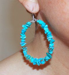 "This is a pair of big turquoise hoop earrings. Matches some of the necklaces and stretch bracelets we have. - natural chip turquoise - 2 1/2\" which includes the earring hooks -sterling silver beads and hooks A Living Stone All Native Americans believe that the earth is living and all things are precious. Turquoise is no exception, representing life, and is highly revered because of its color-changing properties. Factors such as the environment, light, dust, and skin acidity all play a role in Turquoise Hoop Earrings With Natural Stones, Turquoise Natural Stone Hoop Earrings As Gift, Bohemian Turquoise Hoop Earrings With Natural Stones, Turquoise Hoop Earrings With Natural Stones As Gift, Blue Natural Stone Hoop Jewelry, Blue Hoop Jewelry With Natural Stones, Handmade Turquoise Hoop Jewelry, Turquoise Hoop Jewelry, Diy Western Jewelry