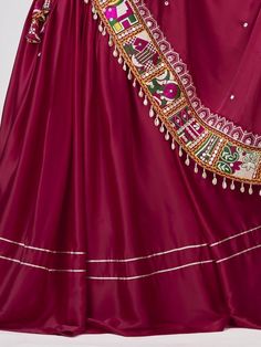 Introducing our amazing maroon gamthi work silk navratri wear lehenga choli, made with maroon satin silk material. This stunning ensemble is perfect for traditional occasions like Navratri, where you want to look elegant and festive.
Let's talk about the benefits of this beautiful lehenga choli. It is made with high-quality satin silk material, ensuring a smooth and comfortable fit. The maroon color adds a touch of sophistication and grace to the overall look. The gamthi work on the choli and at Art Silk Traditional Wear For Navratri, Silk Anarkali Set For Navratri And Traditional Ceremonies, Navratri Art Silk Salwar Kameez For Traditional Ceremonies, Festive Satin Choli With Zari Work, Burgundy Anarkali Dupatta For Festivals, Silk Lehenga With Gota Work For Navratri, Navratri Satin Choli With Traditional Drape, Silk Sharara For Navratri Traditional Ceremonies, Navratri Satin Sets With Zari Work