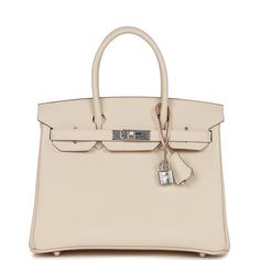 This Retourne Birkin is in Craie epsom leather with palladium hardware, tonal stitching, front flap with two straps, front toggle closure, clochette with lock and two keys, and double rolled handles The interior is lined with Craie chevre and has one zip pocket with an Hermes engraved zipper pull and an open pocket on the opposite side.Collection: UOrigin: FranceCondition: New and never worn (Plastic on hardware)Accompanied by: Hermes box, Hermes dustbag, clochette, lock, two keys, clochette dustbag, felt, carebook, rainhat Measurements: 11.75" width x 9.5" height x 6" depth; 4.25" handle drop Sellier Birkin, Birkin 30, Hermes Birkin 30, Hermes Box, Diaper Backpack, Casual Backpack, Color Ivory, Hermes Birkin, Bago