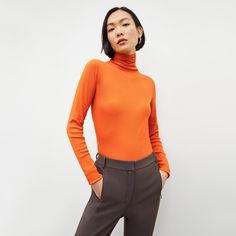 Made from super-soft Peruvian Pima cotton, this fine-ribbed turtleneck is a cool-weather wardrobe staple. Thanks to a fitted silhouette, it’s the perfect thing to layer under blazers and sweaters or tuck into high-waisted pants and skirts . Made in Peru with fabric from Peru. Ribbed Collar Turtleneck For Fall Workwear, Fall Workwear Turtleneck With Ribbed Collar, Fall Ribbed Collar Turtleneck For Work, Fall Turtleneck With Ribbed Collar For Work, High Neck Turtleneck For Workwear, Fall Workwear Turtleneck With Ribbed Cuffs, Fall Turtleneck For Workwear With Ribbed Cuffs, Classic Fitted Spring Turtleneck, Classic Spring Turtleneck With Ribbed Collar