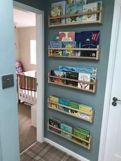 the bookshelf is made out of wooden crates