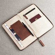 a wallet with a pen and credit card inside