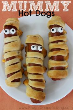 hot dogs wrapped in pretzels with googly eyes on them and the words mommy hot dogs