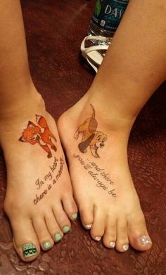 two people with tattoos on their feet and one has an animal tattoo on the foot