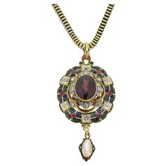 Here we have a stunning antique necklace taken from the personal collection of pop music icon, Sir Elton John. This 18ct yellow gold piece dates back to the Victorian period and showcases a large oval faceted garnet are the centre. This principal stone sits risen at the centre and is accompanied by three trios of rose cut diamonds. Gorgeous enamel work has been expertly carried out around the outer edge in rich red, green, blue, black and white before the piece is finished with individually set Antique Pendant Jewelry For Opera, Antique Yellow Gold Jeweled Necklaces, Antique Yellow Gold Necklaces With Jewels, Antique Temple Necklace With 17 Jewels As Gift, Victorian Necklace With 17 Jewels In Oval Pendant, Vintage Yellow Gold Necklace With Jewels, Vintage Yellow Gold Necklaces With Jewels, Vintage Gold Jewelry For Opera, Vintage Oval Pendant Necklaces With 17 Jewels