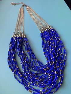 A stunning cobalt blue bead necklace featuring a combination of beautiful blue and gold beads. Perfect for adding a touch of elegance to any outfit! Necklace: Approximate Measurements: 22"(L)  Condition: Necklace is in great condition. - Pre owned (Please see photos for details) Thank you for your interest in my shop! Please contact me for any questions. The items are described as accurately as possible. Please examine the attached photos carefully, as they are part of the description and condit Gold Bead Necklace, Blue And Gold, Blue Beads, Gold Beads, Bead Necklace, Beautiful Blue, Cobalt Blue, Cobalt, Favorite Jewelry