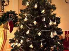 a decorated christmas tree with lights and stockings