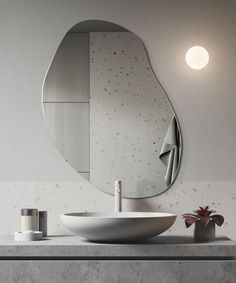 a bathroom with a sink and mirror on the wall