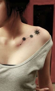 a woman's chest with small stars on it