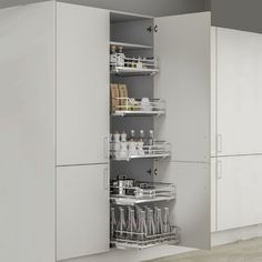 an open cabinet in the middle of a kitchen