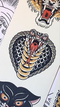 several different types of tattoos on paper with pictures of cats and snakes around them,