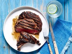 a steak on a plate with a fork and knife