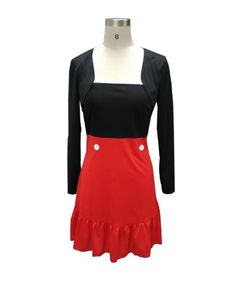 a red and black dress on a mannequin's neckline with buttons