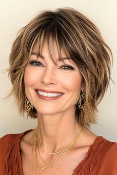 Save this pin for the best short layered haircuts with bangs. This sassy, short layered haircut combines an edgy texture with a flattering shape. The choppy layers create movement and volume, while the highlights really define those layers. Hair Styles For Short Layers, Short Medium Hairstyle Women Layers, Layered Haircuts For Round Faces Medium, Layered A Line Haircut, Shorter Hair With Bangs, Choppy Layered Haircuts For Medium Hair With Curtain Bangs, Messy Bangs Short Hair, Soft Bangs Haircut, Short Haircut With Wispy Bangs