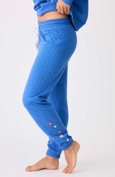 Diamond stitching and colorful embroidery detail these peachy joggers cut in a relaxed fit and perfect for lounging around. Elastic/drawstring waist Elastic cuffs 81% polyester, 14% rayon, 5% elastane Machine wash, dry flat Imported Comfortable Blue Sweatpants For Spring, Blue Spring Joggers With Drawstring, Comfortable Blue Sweatpants With Drawstring, Blue Joggers With Drawstring For Spring, Spring Blue Sweatpants With Drawstring, Blue Drawstring Sweatpants For Spring, Blue Relaxed Fit Joggers With Drawstring, Relaxed Fit Blue Joggers With Drawstring, Blue Drawstring Pants For Loungewear