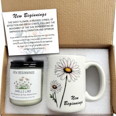 the new beginnings gift set includes a coffee mug, candle and note card in a box