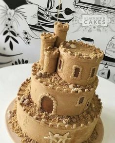 a sand castle cake on a white plate