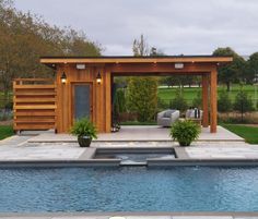 an outdoor living area next to a swimming pool