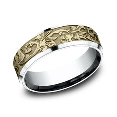 a wedding band with an intricate design in yellow gold and white gold, is shown