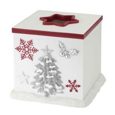 a white box with red trim and snowflakes on the lid is decorated like a christmas tree