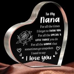 a heart shaped glass plaque with the words to my nana on it