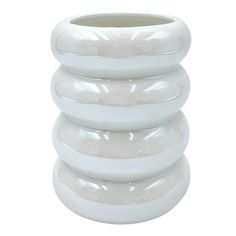 a white vase is stacked on top of each other in the shape of a spiral