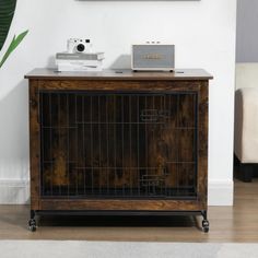 a dog crate sitting on top of a hard wood floor