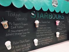 the menu for starbucks's starbucks is displayed on a blackboard with coffee cups