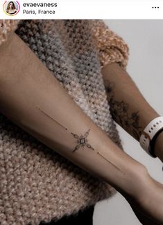 a person with a star tattoo on their arm