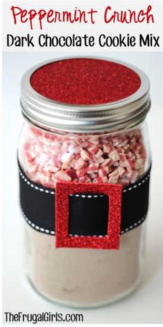 peppermint crunch dark chocolate cookie mix in a glass jar with red glitter on the lid