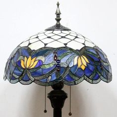 a stained glass lamp with flowers on it