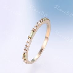 You are looking at a baguette shaped green peridot and diamond wedding ring, natural peridot and natural diamond wedding ring. Stone: *1.5mmx3mm baguette natural green peridot. *0.15 Natural Real Diamonds. SI Clarity and H Color. Metal *925 sterling silver,the side stones are CZ * Solid 10k 14k &18k. *Color:white gold,yellow gold,rose gold. Custom Order *The main stone can be other gemstones you can imagine,any birthstone can be made.Please contact me if you need this service. *Any size *I can a Green Half Eternity Stackable Rings As Gift, Yellow Gold Stacking Rings, Mother's Ring, August Birthstone Ring, Gold Stacking Ring, Green Gemstone Ring, Future Engagement Rings, Mother Rings, August Birthstone