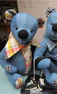 two teddy bears made out of jeans are sitting next to each other