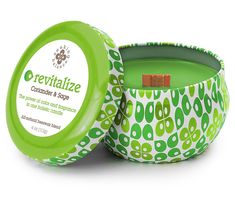 the container is green and has a lid on it that says revitalize surrounded by leaves