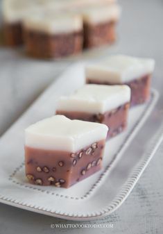 three pieces of cake sitting on top of a white plate