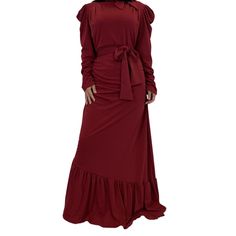 Our decadent Long Sleeve Ruffled Maxi Party Dress is a stylish yet modest statement of fashion. Featuring puffed, gathered sleeves, an elegant high neck, a thick waist tie, and a long skirt with a ruffled hem, this luxurious piece is the perfect choice for all your most fabulous events. Fitted Long Sleeve Dresses With Belted Cuffs, Fitted Maxi Dress With Belted Cuffs, Fitted Maxi Dress With Belted Cuffs For Spring, Fitted Maxi Dress With Sashes For Party, Long Sleeve Belted Dress For Party, Fitted Party Dress With Belt, Belted Dress With Cuffed Belts For Party, Fitted Red Dresses With Sashes, Red Fitted Dress With Sashes