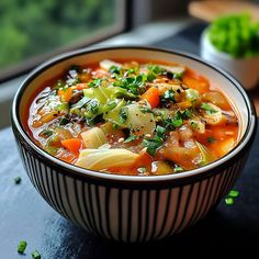 a bowl of vegetable soup on a table