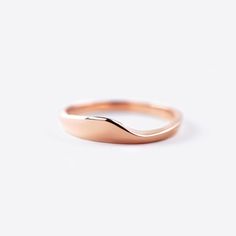 The Agnes Wedding Band is a the companion to our new Iris Engagement Ring. The design compliments the Iris ring with its delicate, elegant design. It is perfect for those who prefer a minimalist approach to wedding bands, this ring perfectly completes Iris and creates the perfect union. Dimensions: 0.75" x 0.25 x 0.475" Available In: 14K Rose Gold, 18k Yellow Gold, 18K White Gold, Platinum Minimalist Promise Band, Timeless 14k Rose Gold Wedding Jewelry, Timeless 14k Rose Gold Wedding Rings, Minimalist Rings With Timeless Design For Anniversary, Minimalist Polished Promise Band, Minimalist Anniversary Ring With Timeless Design, Minimalist Anniversary Rings With Timeless Design, Minimalist Anniversary Rings, Wedding Ring With Smooth Bezel In 14k Gold