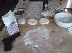 the table is covered with uncooked pizza dough