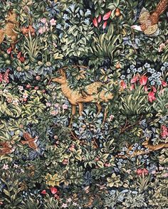 an image of a tapestry with animals and flowers on it