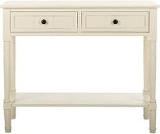 a white console table with two drawers