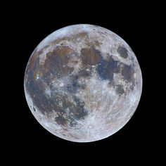 the full moon is seen in the dark sky