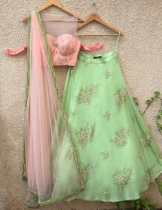 This set features peach blouse with gota work and pleat cold-shoulder detail; teamed with pista green pearl buti lehenga on net with raw silk Pista Green Lehenga, Simple Lehenga, Pista Green, Lehenga Design, Indian Outfits Lehenga, Lehnga Dress, Peach Blouse, Green Lehenga, Gold Skirt