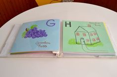 two children's books sitting on top of a white table