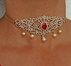 18 karat gold '2 in 1' diamond choker necklace with japanese culture pearls & color stones
  this product has inter changeable stones in the necklace.
  it can also be used as arm patti (armlet)
  length of the arm patti : 10.00 - 16.00 inches
    

introducing our exquisite 18 karat gold '2 in 1' diamond choker necklace, crafted with precision and artistry in india by totaram jewelers. this stunning piece features a combination of japanese culture pearls and color stones, creating a truly uniqu Luxury Temple Jewelry Choker For Women, Luxury Women's Temple Jewelry Choker, Traditional Diamond Choker For Festive Occasions, Traditional Diamond Choker Gift, Vanki Designs Jewellery, Gold Hand-set Temple Jewelry Choker, Diamond Choker Necklace, Color Stones, Diamond Choker