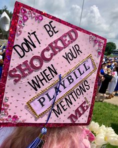 a pink graduation cap that says don't be shocked when your playbill mentions me