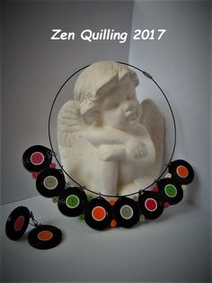 an image of a white statue with black and red circles around it that says, zen quilting 2017