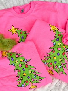 Experience the holiday spirit with our Who Christmas Tree Sweatshirt! This unisex crewneck features an adorable Whoville tree on the front, making it a perfect mix of festive and stylish. With a true-to-size fit, stay cozy and trendy for the season. Who Christmas Tree, Pink Malibu, Holiday Fits, Whoville Christmas, Cartoon Christmas Tree, Ballerina Costume, Christmas Tree Graphic, Christmas Tree Tops, Pull Rose